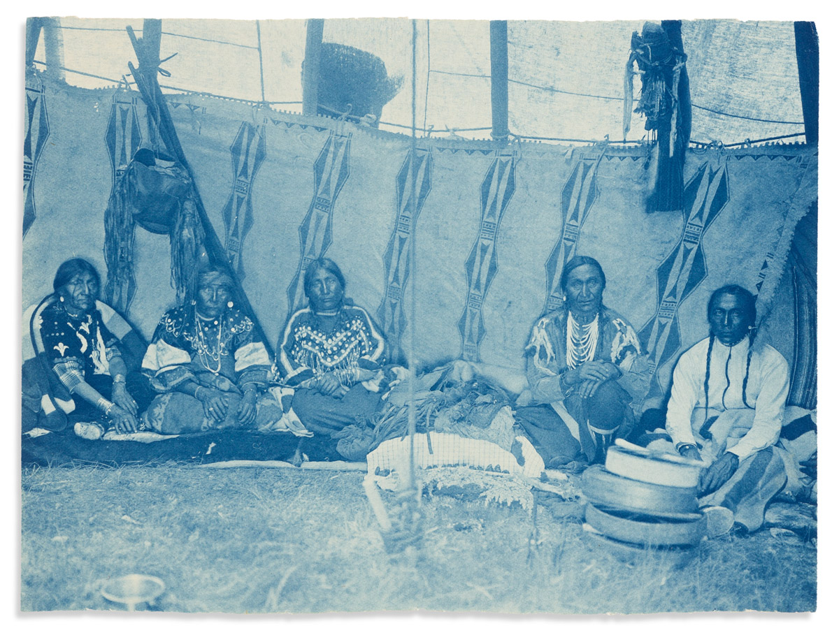 (AMERICAN INDIANS--PHOTOGRAPHS.) Edward S. Curtis. Unpublished cyanotype of five men in a Piegan lodge.